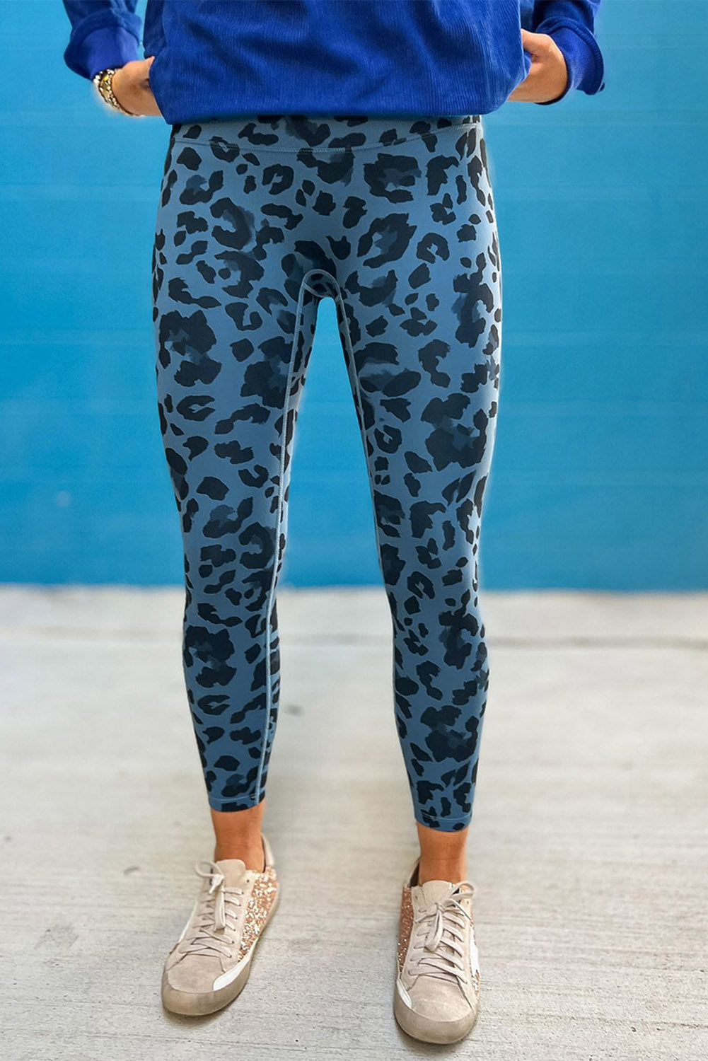 Woman wearing Classic Leopard Print Active Leggings in an urban setting