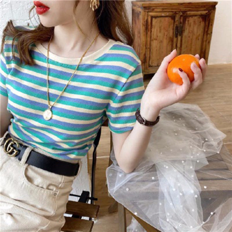 Woman wearing Women’s Stripe Short Sleeve Slim Fit Casual Top in a casual setting