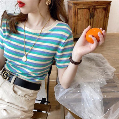 Woman wearing Women’s Stripe Short Sleeve Slim Fit Casual Top in a casual setting