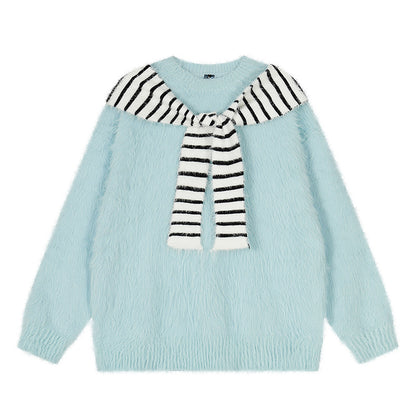 Woman wearing Oversized Loose Fit Poncho Knit Sweater in a cozy indoor setting