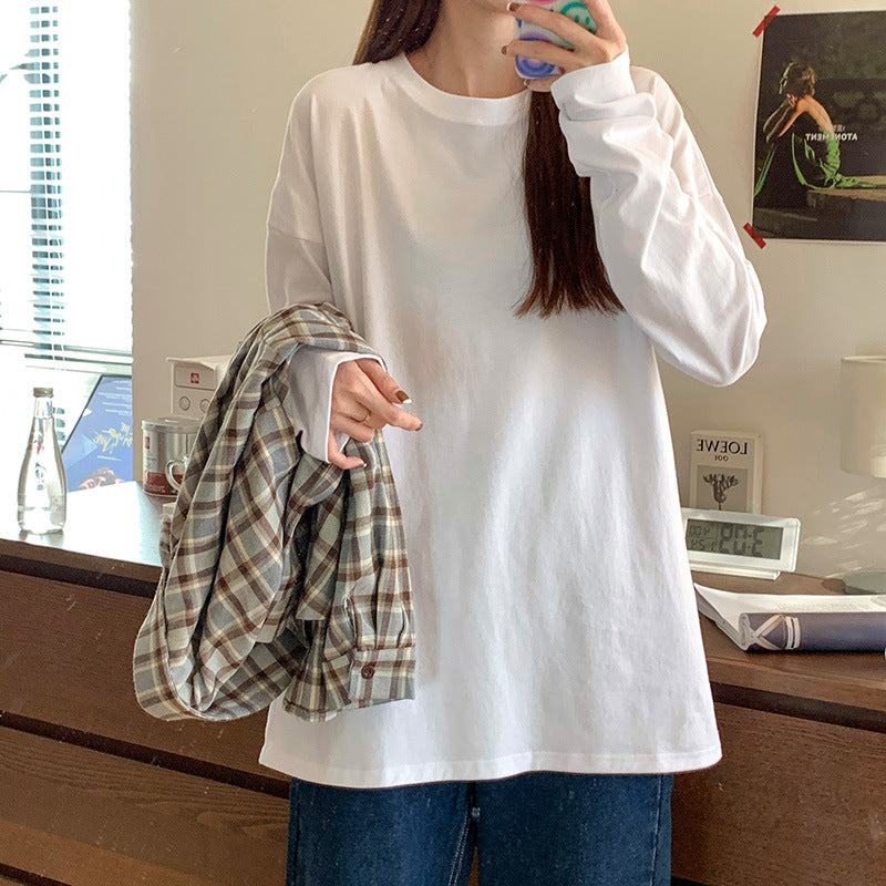 Woman wearing Women's Long Sleeve Loose Fit Basic Tee Top in a casual setting