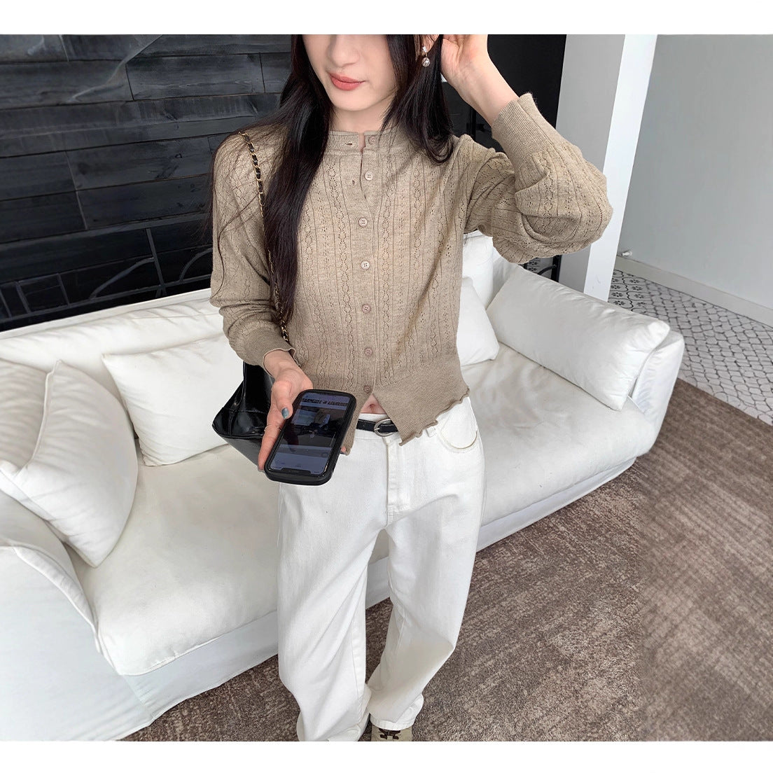 Woman wearing Hollow-Out Knit Cardigan Coat in casual setting