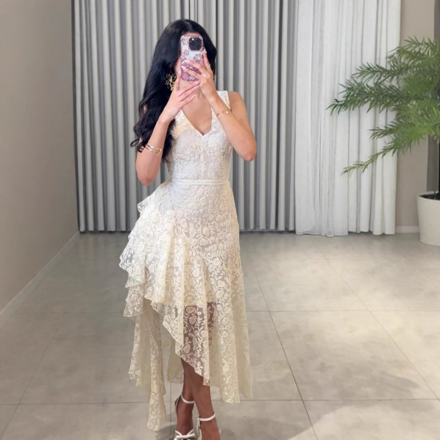 Woman wearing Asymmetric Jacquard Dress in an elegant setting