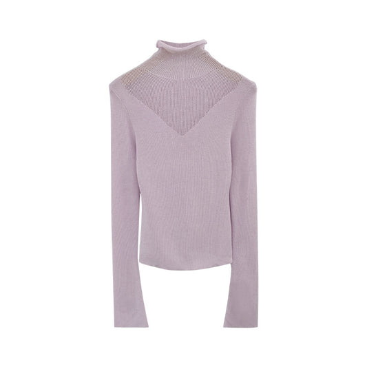 Woman wearing High Neck Sheer Panel Knit Top in a stylish urban setting