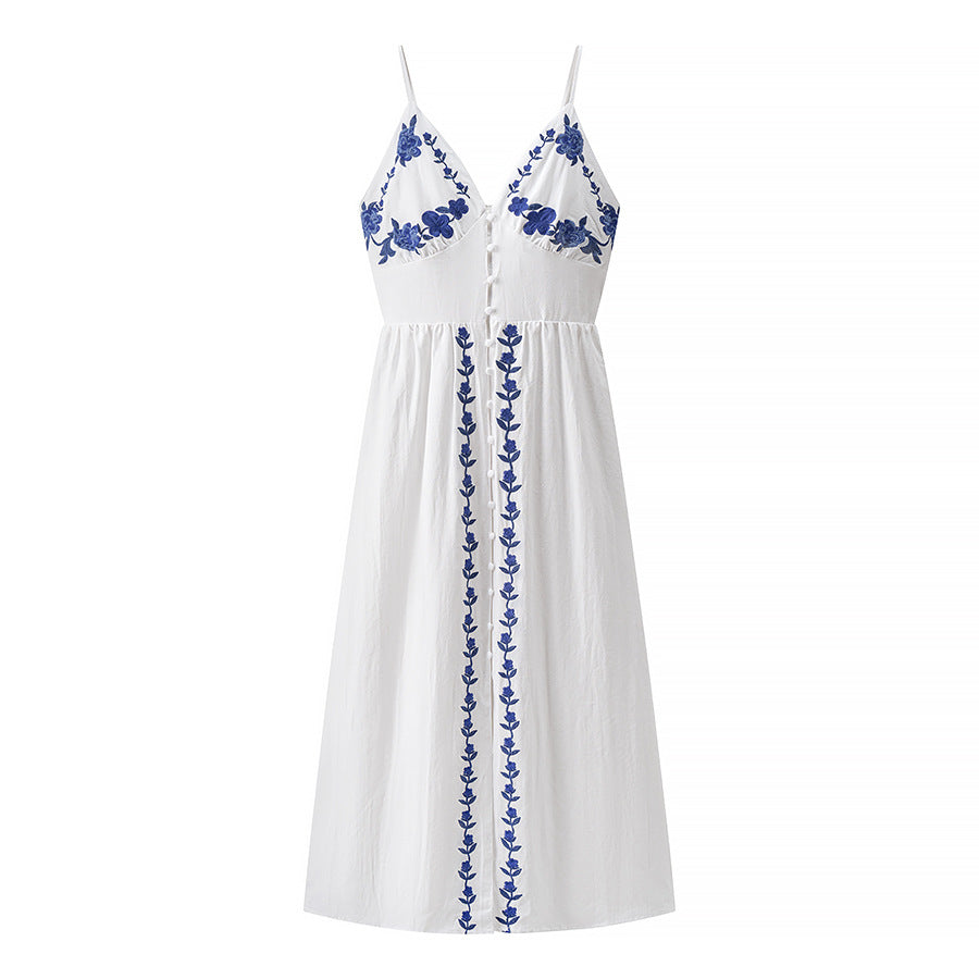 Woman wearing Embroidered Strapless Midi Dress in a sunny garden