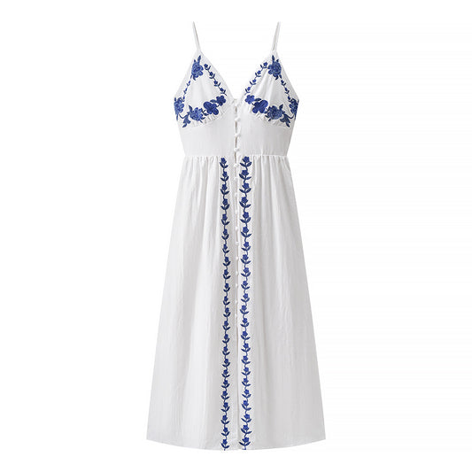 Woman wearing Embroidered Strapless Midi Dress in a sunny garden
