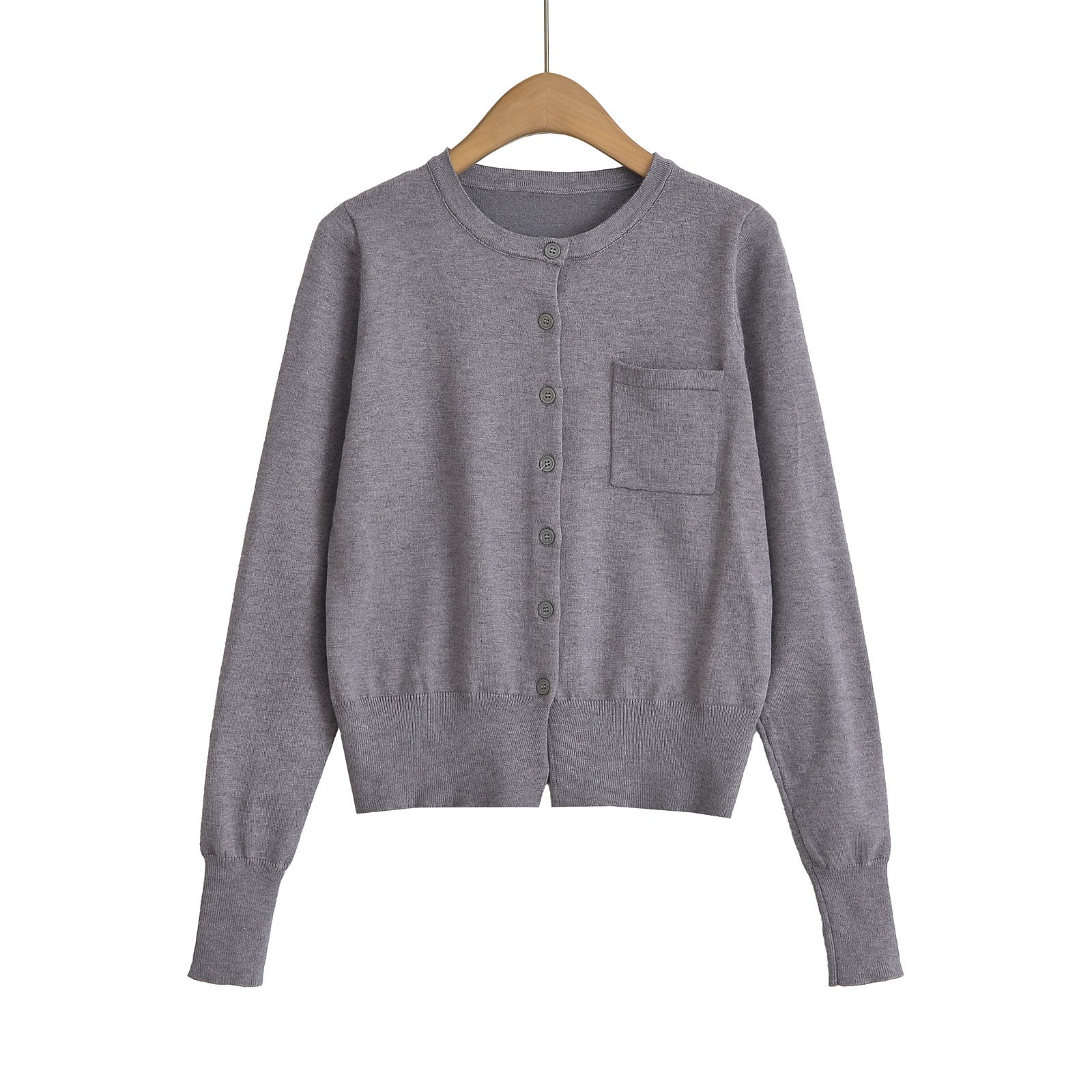 Woman wearing Round Neck Long Sleeve Shirt with Pocket in a casual setting