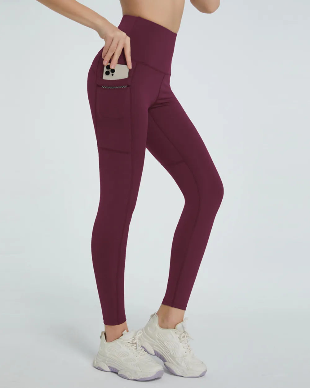 Woman wearing High Waist Active Leggings in a fitness setting