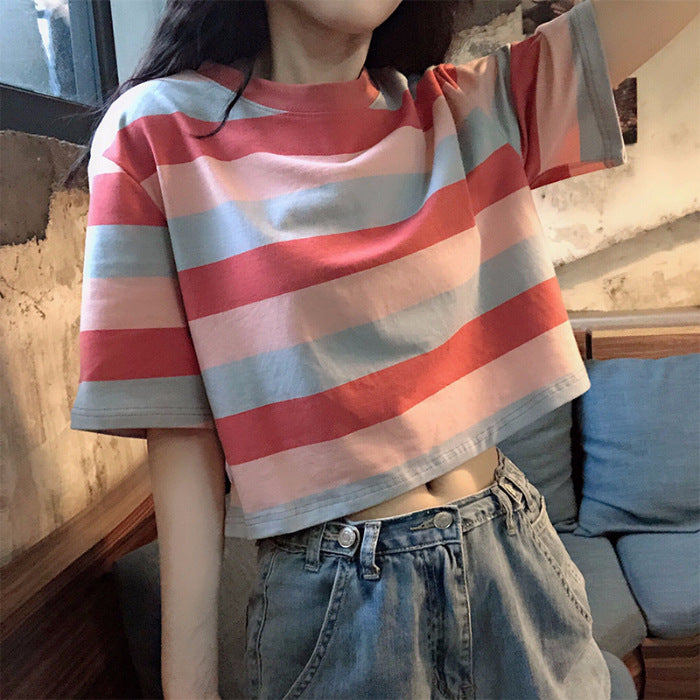 Woman wearing Loose Rainbow Striped Crop Top in a sunny park