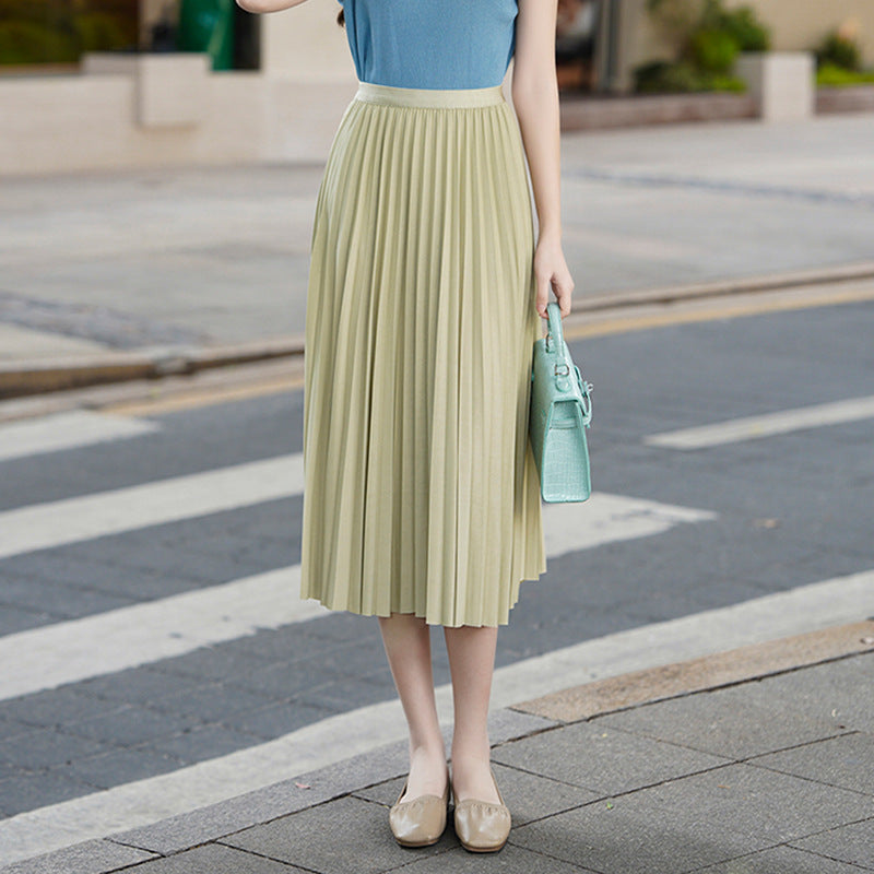 Woman wearing Solid Pleated Skirt in a casual outdoor setting