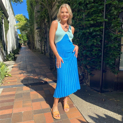 Woman wearing backless knit dress in a casual setting