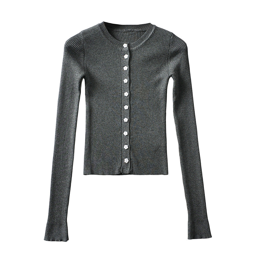 Woman wearing Round Neck Buckle Detail Slim Fit Long Sleeve Top in an office setting