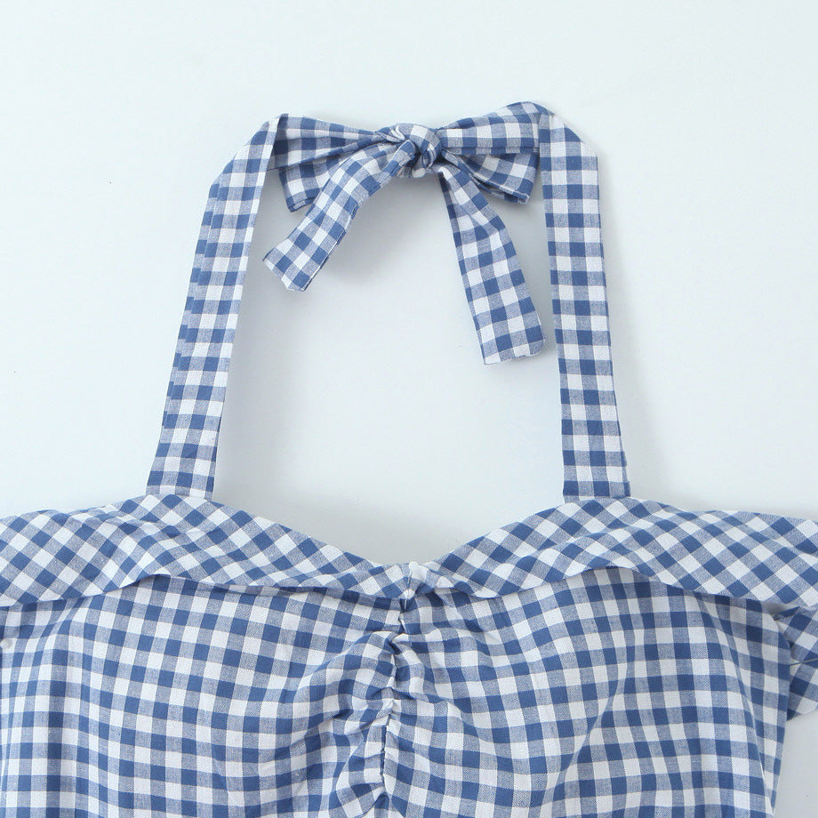 Woman wearing Plaid Bow Tie Neckline Bodycon Dress in an elegant setting