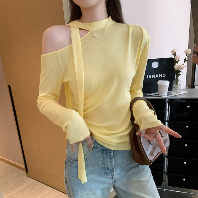 Woman wearing Lace Up Butterfly Long Sleeve Top in a casual setting