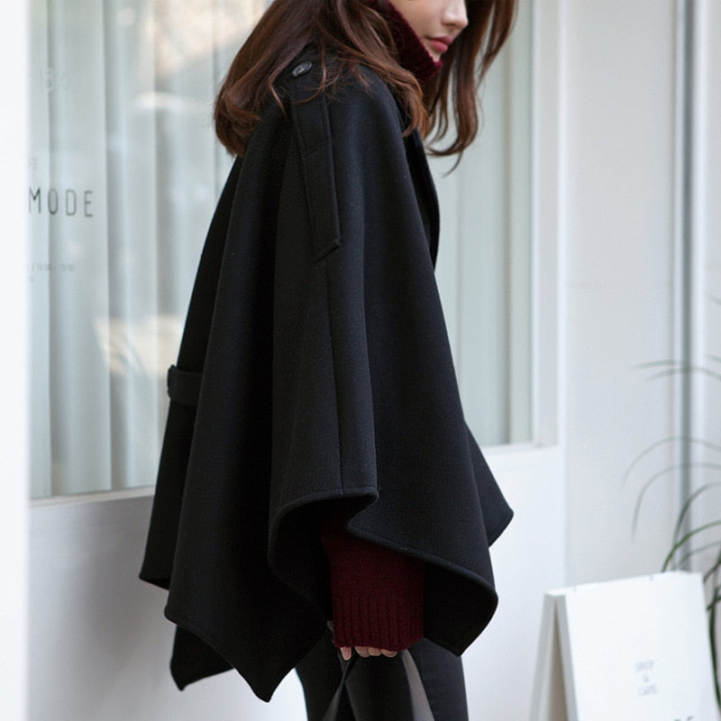 Woman wearing Plus Size Black Winter Poncho Cape Coat in a winter setting