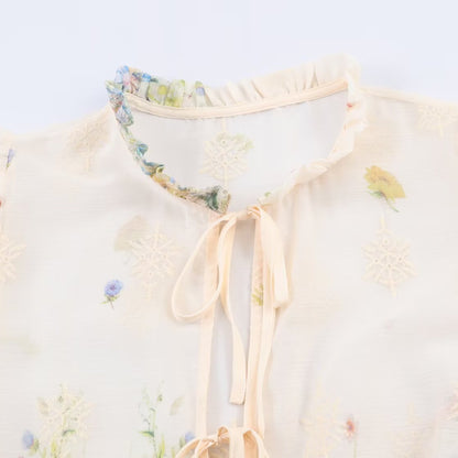 Woman wearing Embroidered Lantern Sleeve Shirt with Lace-Up Tie in a stylish setting
