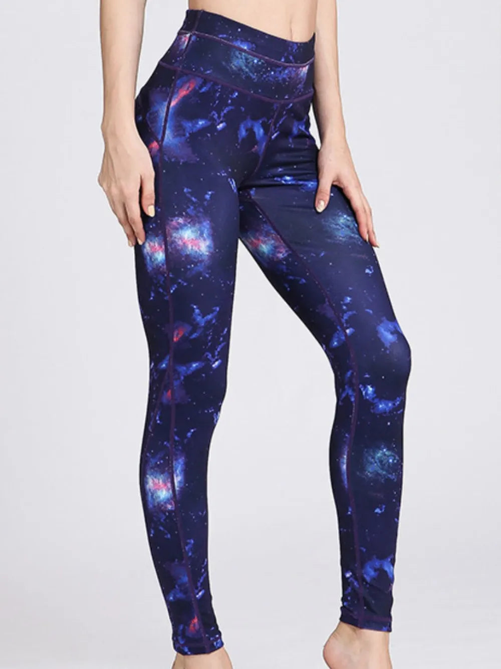 Woman wearing Printed Active High Waist Leggings in a stylish gym setting