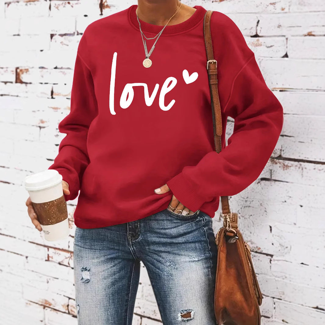 Woman wearing Love Printed Hoodie in a casual setting