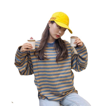 Woman wearing Chic Korean Style Stripe Long Sleeve Tee in a casual setting