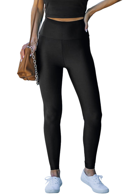 Woman wearing Black High Rise Tight Leggings in a casual setting