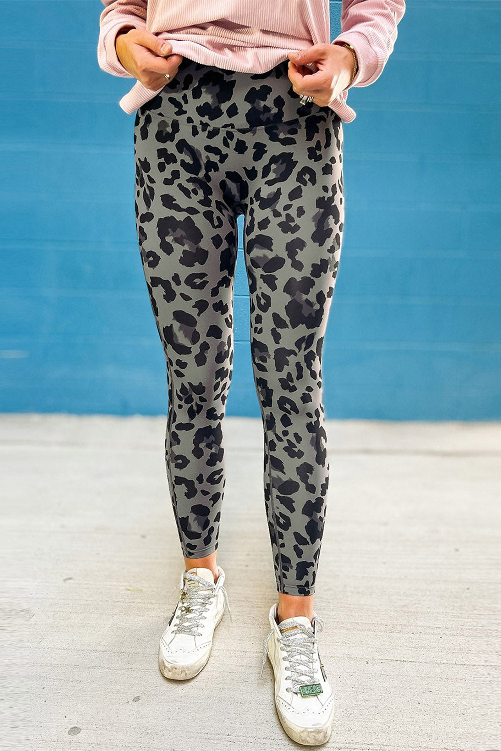 Woman wearing Classic Leopard Print Active Leggings in an urban setting