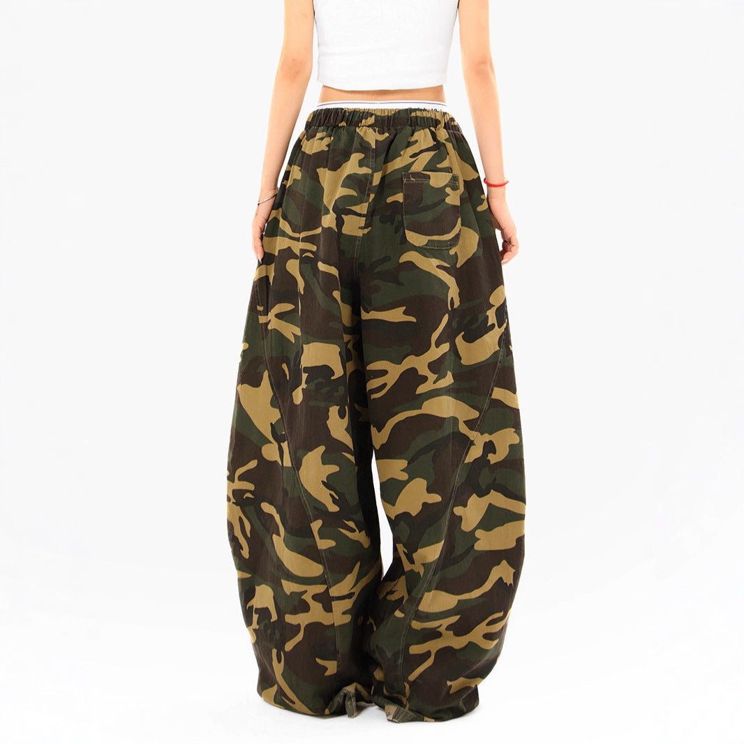 Woman wearing camouflage straight leg casual pants in an urban setting