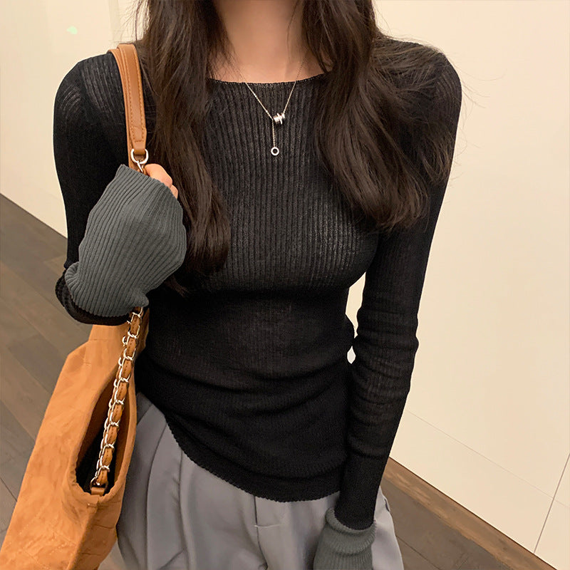 Woman wearing Colour Block Slim Fit Knit Sweater in a stylish urban setting
