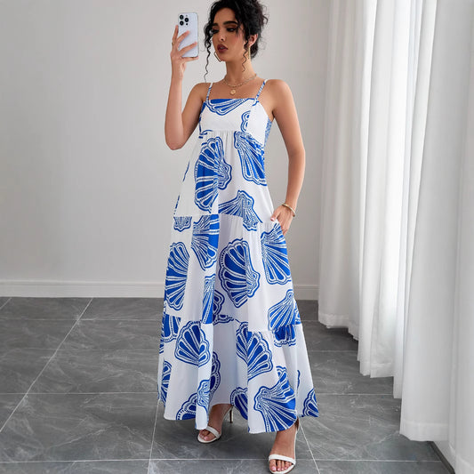 Woman wearing Printed Sleeveless Layered Maxi Dress in a sunny beach setting