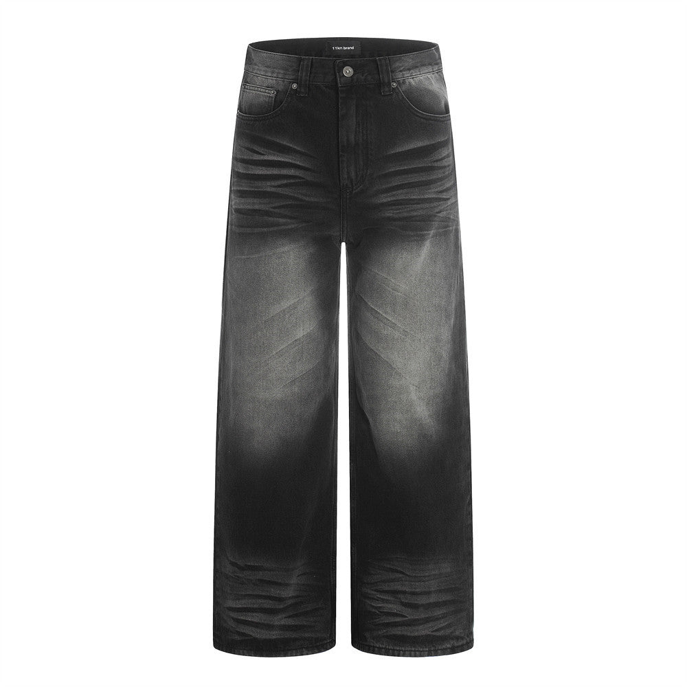 Woman wearing Distressed Black Washed Denim Straight Leg Pants in a street setting