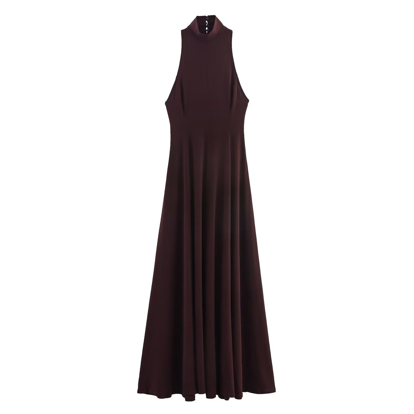 Woman wearing backless long dress in a sunny outdoor setting