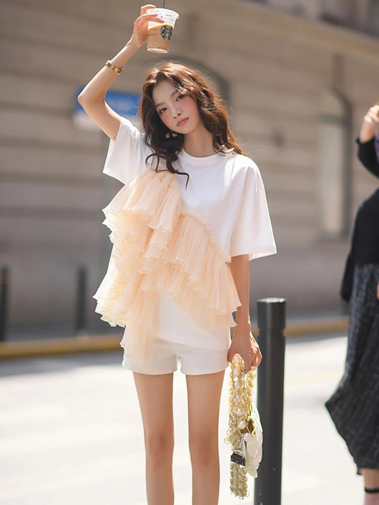Woman wearing Cotton Mesh Patchwork Loose O Neck Short Sleeve T Shirt in a casual setting