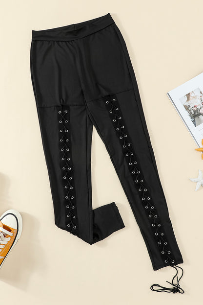 Woman wearing Black Grommet Lace Up Front Leggings in a stylish setting
