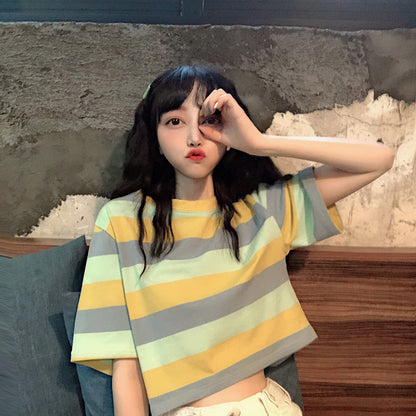 Woman wearing Loose Rainbow Striped Crop Top in a sunny park
