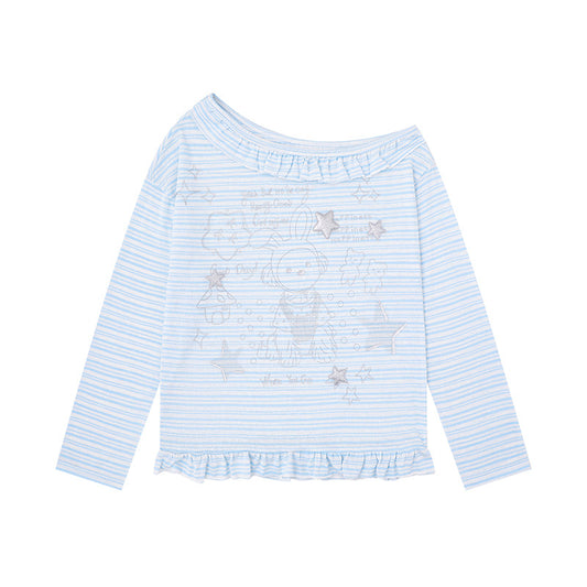 Woman wearing Anime Print Asymmetric Neck Long Sleeve Top in a casual outdoor setting