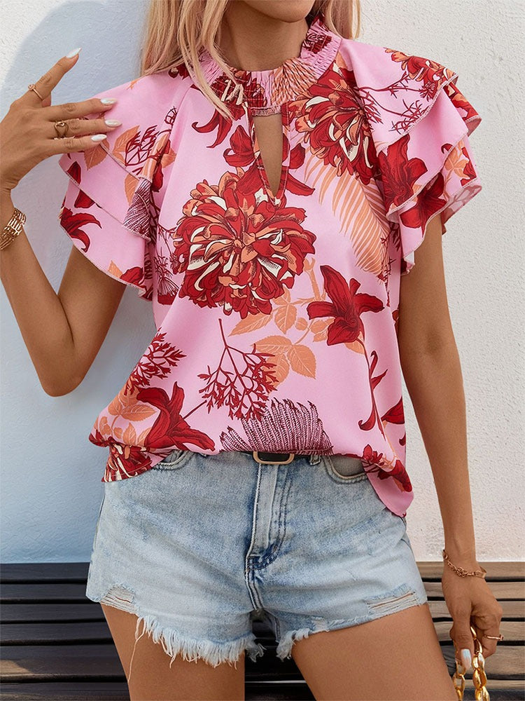 Woman wearing Lotus Leaf Layered Sleeve Printed Shirt in a sunny outdoor setting