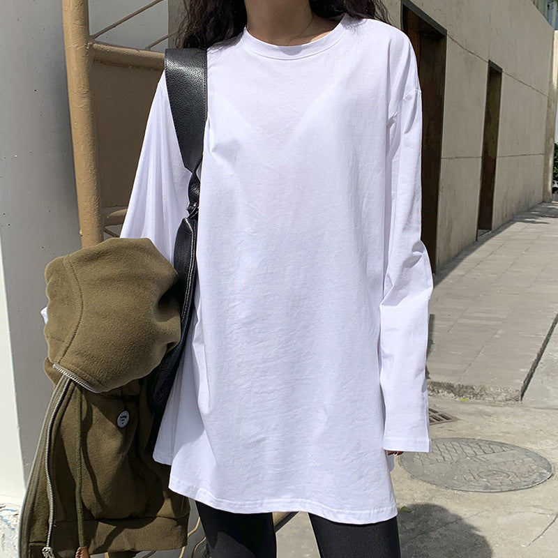 Woman wearing Solid Color Side Slit Long Sleeve T-Shirt in a casual setting