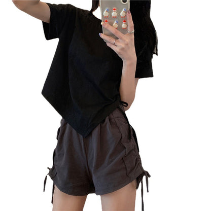 Woman wearing Irregular Drawstring Cropped T-Shirt in a city setting