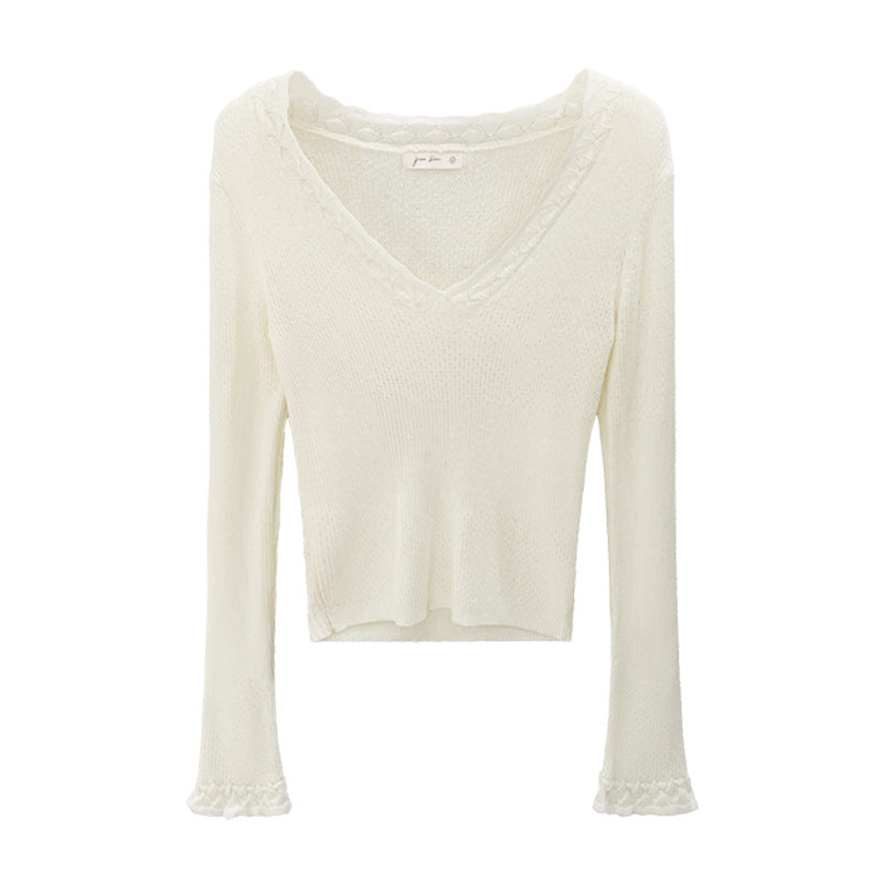 Woman wearing Slim Fit V-Neck Knit Top in a casual setting