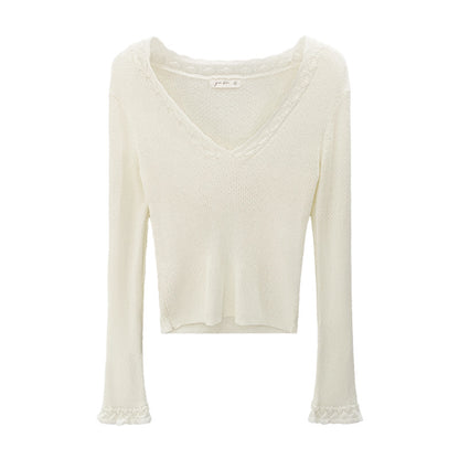 Woman wearing Slim Fit V-Neck Knit Top in a casual setting