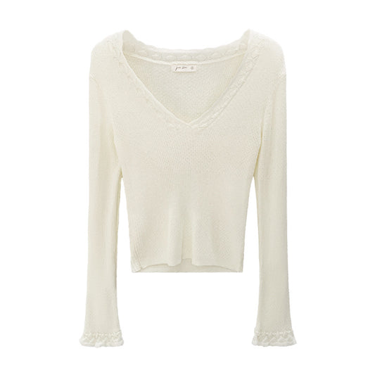 Woman wearing Slim Fit V-Neck Knit Top in a casual setting