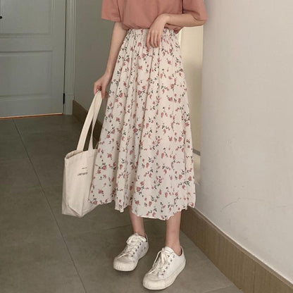 Woman wearing Floral Bohemian A-Line Midi Skirt in a sunny park