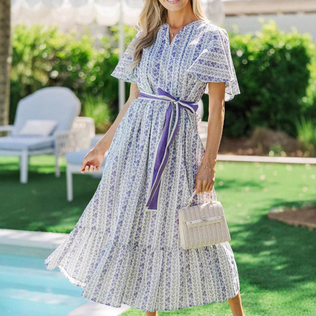 Woman wearing Bohemian Floral Ruffle Maxi Dress in a garden