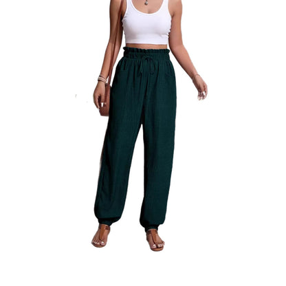 Woman wearing Elastic Solid Color Pants in a casual setting