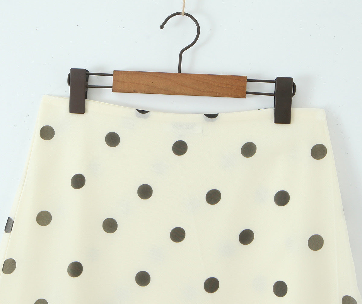 Woman wearing Wave Point Polka Dot Midi Skirt in a city setting