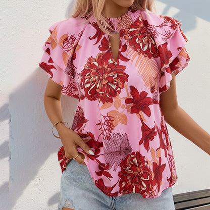 Woman wearing Lotus Leaf Layered Sleeve Printed Shirt in a sunny outdoor setting