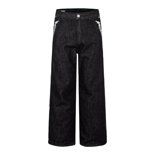 Woman wearing Washed Black Vintage Patchwork Jeans in an urban setting
