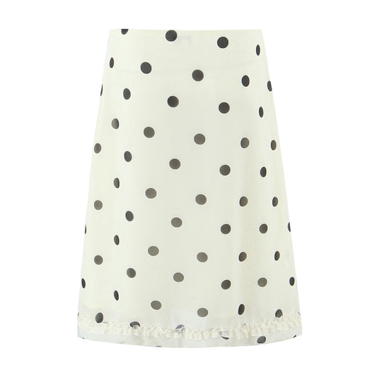 Woman wearing Wave Point Polka Dot Midi Skirt in a city setting