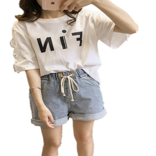 Woman wearing Letter Print Loose Fit T-Shirt in a casual setting