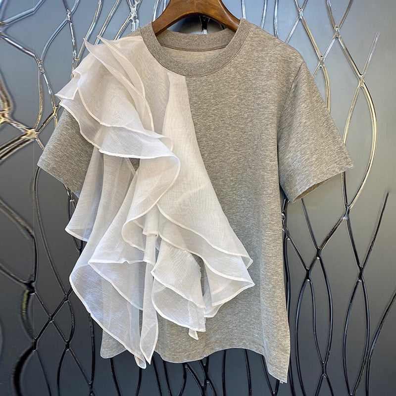 Woman wearing Patchwork Ruffle T-Shirt in a casual summer setting