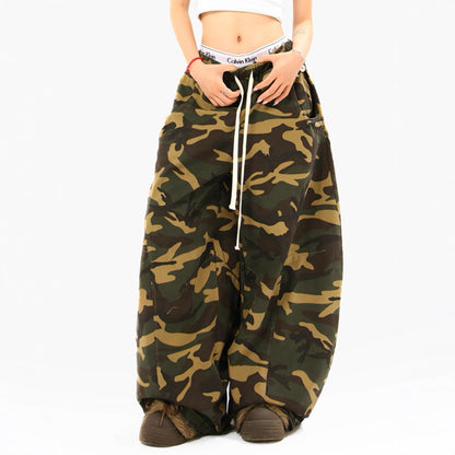 Woman wearing camouflage straight leg casual pants in an urban setting